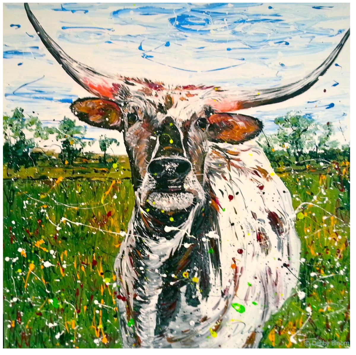 Longhorn cow standing in wildflower field