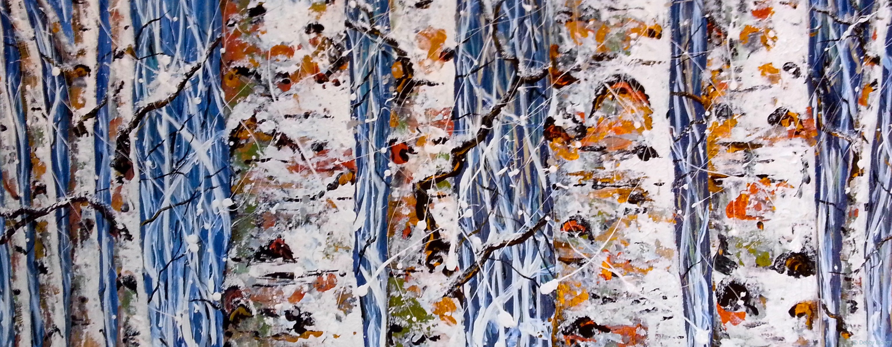 Birch tree trunks in winter snow